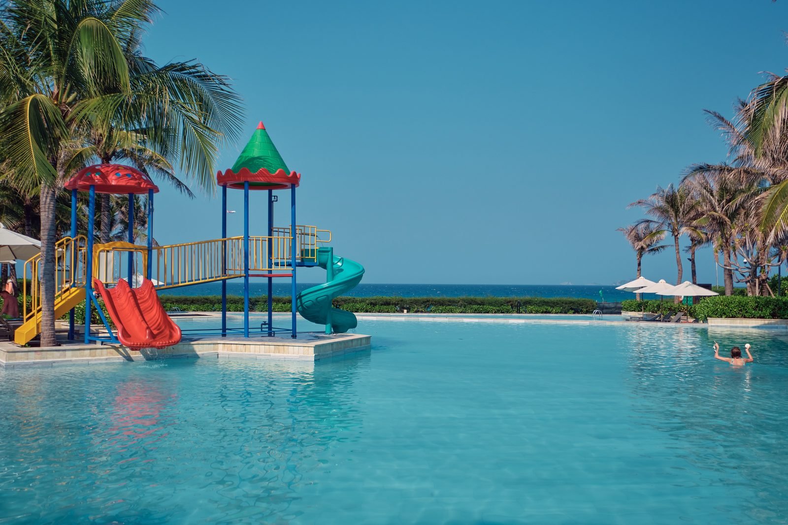 Pool slides and play towers in the resort pool