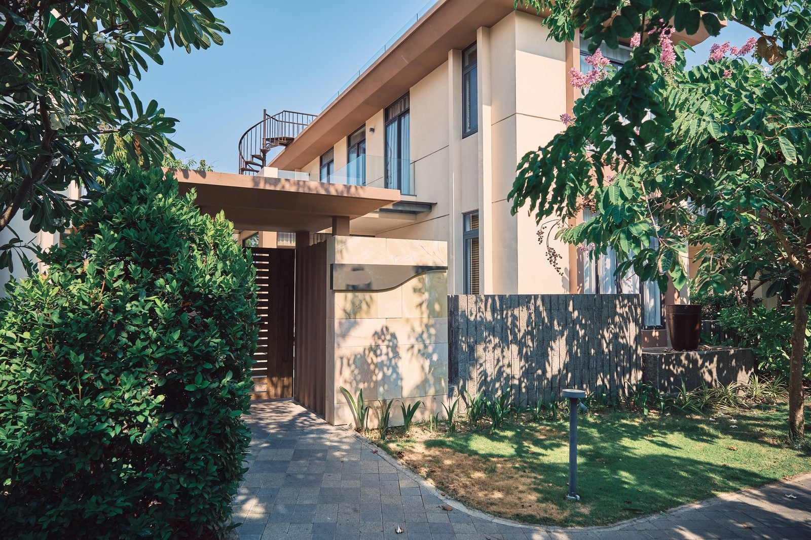 Garden entrance and villa exterior of a Superior Pool Villa